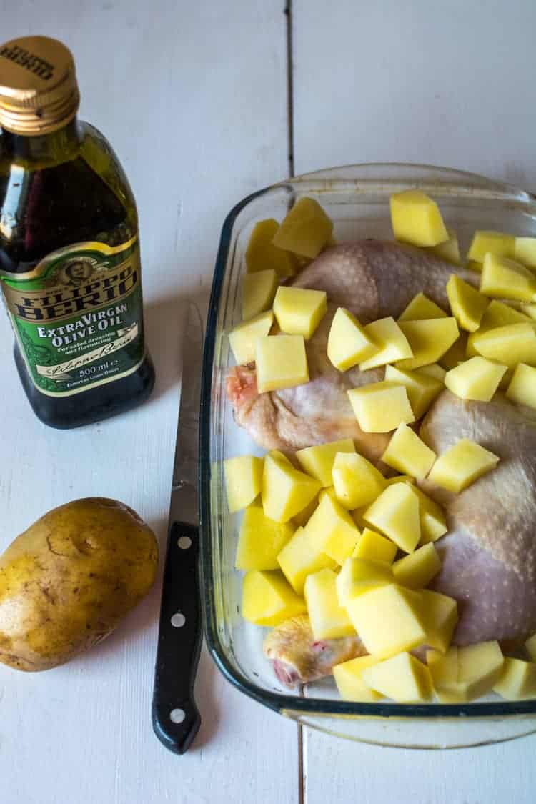 preparing the chicken and potatoes