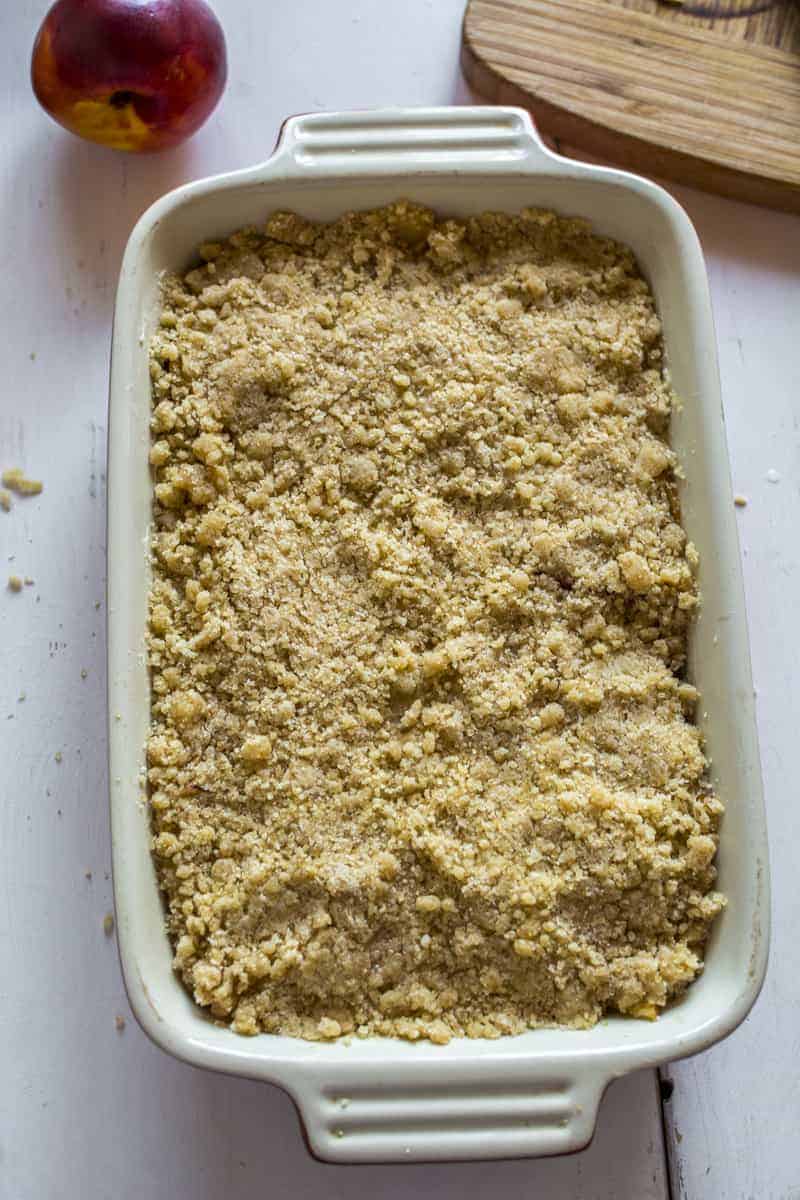 press crumble over the fruits