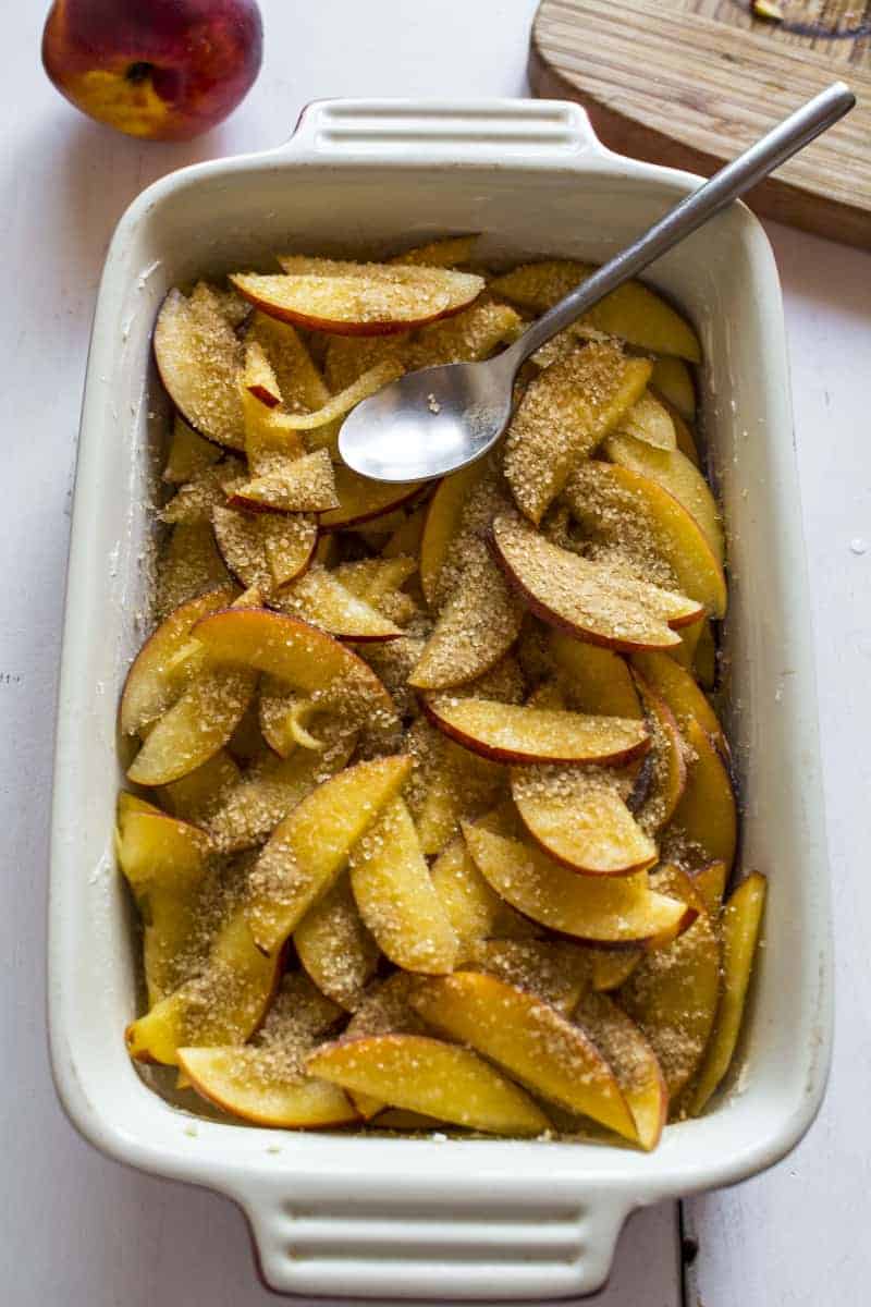 sprinkle peach slices with sugar