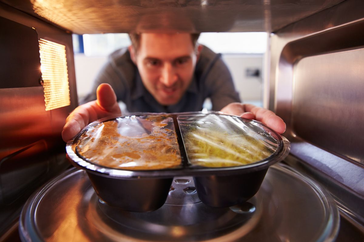 On every Saran wrap package, it states that it is “not safe for use in conventional ovens, browning units, stovetops, or toaster ovens.” This is because of the chemicals in Saran wrap that can easily melt into food when heated. This can even happen before the melting temperature of the plastic wrap is reached.  While you should never use Saran wrap in your oven, there is one technique that allows you to use it safely. This involves some improvisation on your part.  This guide will teach you how to use Saran wrap safely in the oven and what you need to understand about the dangers of using heated Saran wrap incorrectly. What Is Saran Wrap? The word “Saran” is actually a trade name for a specific type of plastic wrap, owned by Johnson and Son.   Saran wrap is made of linear low-density polyethylene, making it puncture resistant with high tensile strength. It is often used to store food in a refrigerator or freezer to keep it fresh. It can also be used for reheating meals in a microwave oven.  This polyethylene wrap is able to block out air when used to wrap food, helping to preserve moisture content and seal the contents effectively. This protection means food remains fresher for longer, and is able to withstand both high and low temperatures. Saran wrap has a higher melting point than other plastic wraps available on the market. How To Use Saran Wrap In The Oven When plastic is exposed to high temperatures, chemical toxins are released into the food and atmosphere, so manufacturers of any kind of plastic wrap, including Johnson and Son, do not recommend it for oven-use.   Regardless of these warnings, you’ll be surprised to know that the majority of restaurant chefs actually do use Saran wrap when cooking. According to them, wrapping foil on top of the plastic wrap and keeping the heat at a low temperature can seal food better than anything else!   Chefs recommend that if you want to use plastic wrap when cooking, you should use branded wraps like Saran wrap. This is because good quality plastic wrap won’t release toxins at the same rate as supermarket-owned brands or lower quality polyethylene wraps.  High quality plastic wraps like Saran wrap are BPA-free, meaning they don’t contain Bisphenol A. This is an industrial chemical used in the construction of plastics. Without this chemical, Saran wrap is less toxic than plastic wraps that do contain BPA.    The best method for using Saran wrap in the oven is to double layer it with aluminum foil. This has been proven by both scientists and chefs alike. When Saran wrap is double layered with aluminum foil, the plastic wrap is protected from reaching a temperature greater than 212°F, meaning that it won’t melt. The foil acts as a shield against the hot air and radiation from the standard conventional oven.   Aluminum foil does not retain or absorb heat, so it will never get hot enough to melt the Saran wrap it’s protecting. With an extra layer of aluminum foil covering the Saran wrap, it won’t get hotter than 212°F, allowing for a comfortable distance between its 220°F melting point.  In summary, for perfectly sealed food that remains tender and moist, you need to:  Cover the Saran wrap with aluminum foil after you’ve covered the food. You can use as many layers as you like for this. Keep the cooking temperature below 250°F. 