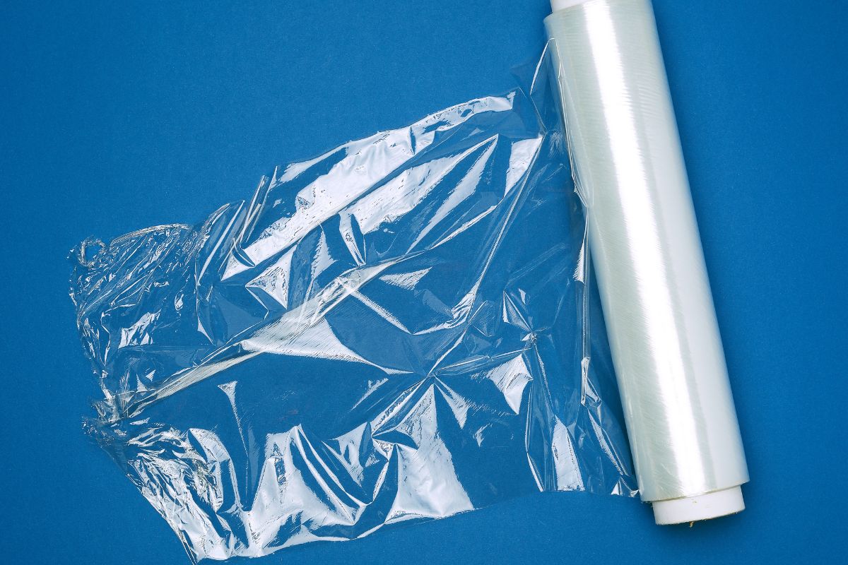 Does Saran Wrap Melt? It is unlikely that Saran wrap won’t melt if used in an oven without an aluminum foil layer to protect it.  Saran wrap is thinner than a plastic bag and generally cannot handle the high temperatures of a conventional oven. Most polyethylene wraps start to melt at 220°F and we usually cook food at higher temperatures of around 300-400°F. Even hot food out of the oven can cause Saran wrap to melt when it comes into contact with it.  Hazards Even before plastic wrap has reached its melting point, toxins can seep into the food it’s wrapped around, according to Environmental Health News. They also state that the FDA has ignored some of the effects caused by a low dose of endocrine-disrupting chemicals. This refers to substances that interfere with the body’s hormone system. Some scientists even question BPA-free wraps and plastic wraps that are marketed as “food-safe”.  There is also the question of non-intentionally added substances that are present in Saran wrap that are outside of the manufacturer’s control. These substances could be side products, contaminants, break down products, or a combination of these.  These are all points you should consider before deciding to use Saran wrap in the oven. Overall, it is probably better if you don’t use Saran wrap when cooking at all due to the many chemical risks involved. However, if you do wish to use it, be sure to cover the plastic wrap with aluminum foil and cook at a low to moderate temperature. Safer Alternatives To avoid any of the risks associated with using Saran wrap in the oven, there are other, safer alternatives you can use.  Instead of using Saran wrap, you can opt to use an oven bag instead, which is completely safe to use and designed for oven cooking. They are heat-resistant and made from grease-proof paper or nylon bags to lock in moisture, leaving your food tender and juicy. These flexible bags give you the same results as using Saran wrap with aluminum foil would.   Oven bags can be bought at your local grocery store or online. They are both durable and strong, as well as budget-friendly. They are also very easy to use - all you have to do is put your meat, vegetables, spices, and sauces in the bag and place it in the oven. They can even be used in the microwave.  Oven bags also feature detailed usage instructions on their packaging, so you’ll be able to get it right every time. There are also online recipes specifically for oven bags, so you’ll be able to cook whatever you want. Unfortunately, they are single-use, but this is the same for plastic wrap and aluminum foil, so an oven bag is definitely a better option if using Saran wrap makes you concerned.  Oven bags are definitely a great alternative that is stress-free, toxin-free, and gives you a tasty meal every time when you refer to the instructions on the packaging.